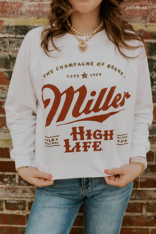 Model wearing oversized Miller High Life Sweatshirt.