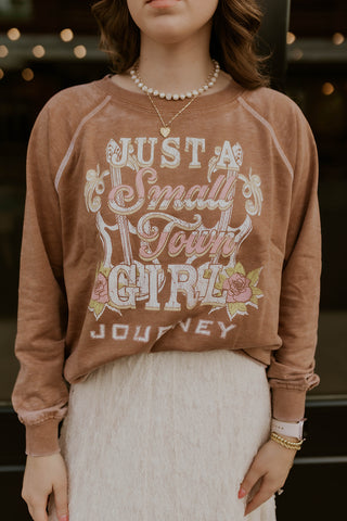 Model wearing Just A Small Town Girl Journey Sweatshirt.