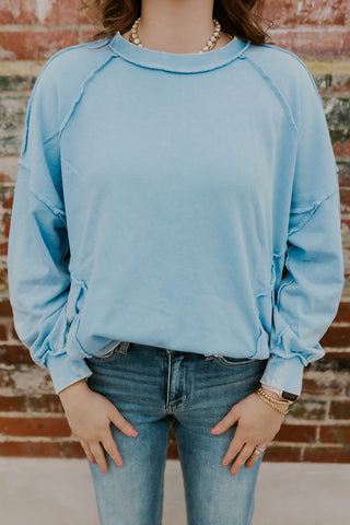Model wearing Oversized mineral wash sweatshirt in peri blue.