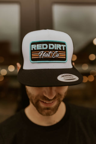 Between The Line Red Dirt Trucker Hat