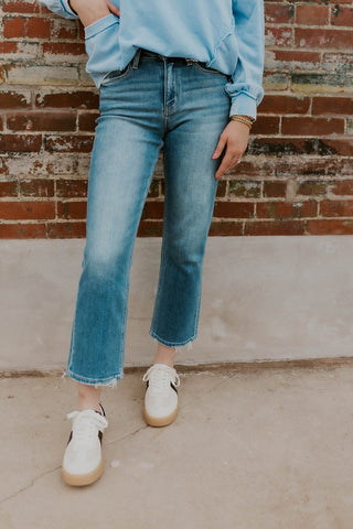 Model wearing Tessa Straight Leg Jeans and sneakers.