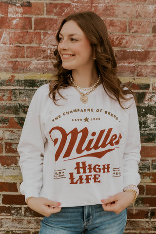 Model wearing Oversized Miller High life Sweatshirt.